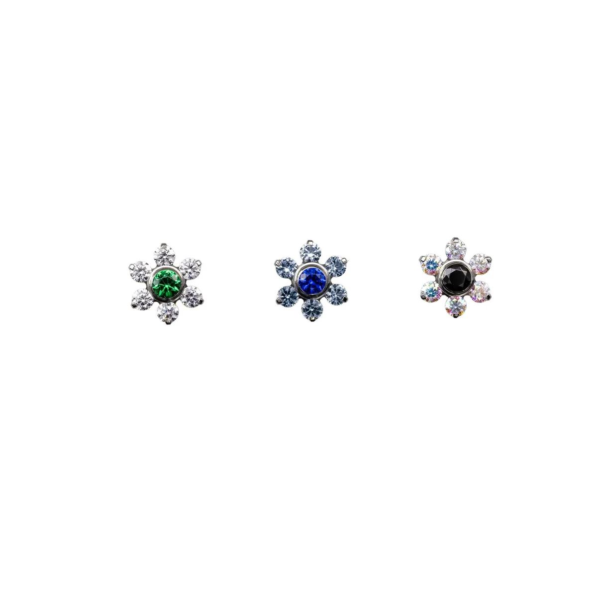Petal ring of small gems around a centre stone — floral threadless end from Canasteel.